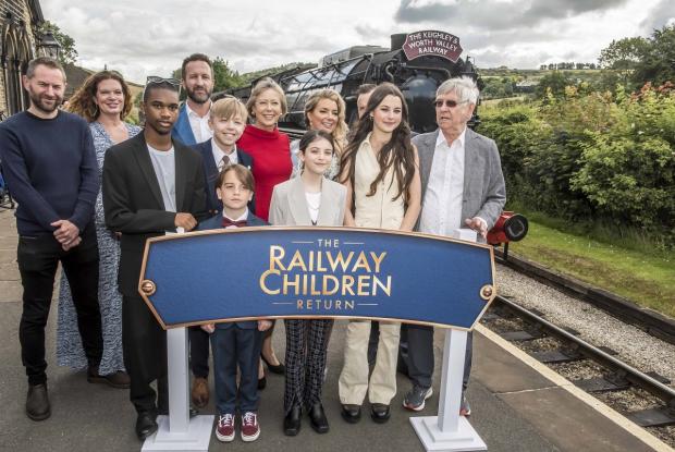 Bradford Telegraph and Argus: The cast of The Railway Children Return at Oakworth, with, left, writer Danny Brocklehurst, producer Jemma Rodgers and director Morgan Matters